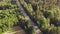 Aerial view over busy road through the forest