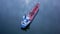 Aerial view over cargo transport ship sailing on a wide lake in summer sunrise