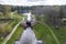 aerial view over dam lock sluice on lake impetuous waterfall