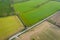 Aerial View over Fresh Green Farming Fields