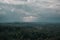 Aerial view over the green forest in evening. Cloudy mystery. Landscapes of Latvia.