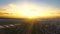 Aerial view over Israel at sunset with open fields and traffic roads and agriculture view. Panoramic wide view over
