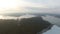 Aerial view over lake in winter at sunset