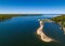 Aerial view over a large sandbar in the green waters of Oyster Bay in Lloyd Harbor on Long Island