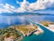 Aerial view over Lefkada Fortress and rotating floating swing br