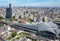 Aerial view over the modern & futuristic architecture of Taichung Train Station in downtown, with high rise towers standing among