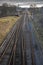 Aerial view over railway tracks heading into distance