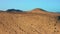 Aerial view over sand desert and the massive rock formations. Sandy dunes near to Costa Calma. Fuerteventura, Canary