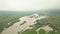 Aerial view of the overflowing river. Drone in the clouds. Extremely high water level in the river. Natural disaster in