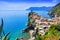 Aerial view overlooking the beautiful Cinque Terre village of Vernazza and the blue sea, Italy