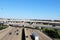 An aerial view overlooking a busy freeway interstate exchange from above with multiple lanes of freeway traffic below