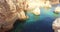 Aerial view overlooking the Praia da Marina beach. Yellow rock formation.