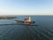 Aerial view of the Paard van Marken at sunrise traditional historic landmark monument light house on the shore of the