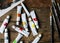 Aerial view of paint tubes and brushes on wooden table