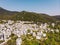 Aerial view of Panagia town in Thasos Island with traditional greek white houses and stone roof