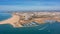 Aerial view of the panorama of the sea bay of Portimao, marinas with luxury yachts. Passing ships with tourists.