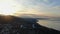 Aerial view panoramic hyperlapse sunrise over mountains on the seashore.