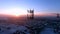 Aerial view panoramic landscape of cell towers at dawn in winter.