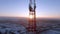 Aerial view panoramic landscape of cell towers at dawn in winter.