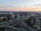 Aerial view panoramic landscape of Moscow city at sunrise. Multi-level intersection on an expressway in the city