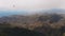 Aerial view - panoramic view of a green valley in a tropical climate. The bird flies in front of the drone camera