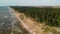 Aerial view of a paraglider flying over the Dutchman`s Cap, Lithuania