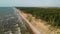 Aerial view of a paraglider flying over the Dutchman\'s Cap, Lithuania