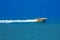 Aerial view of a parasailing boat on the sea