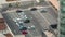 Aerial view of a parking lot with many cars in rows timelapse