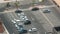 Aerial view of a parking lot with many cars in rows timelapse