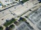 Aerial view parking lots with vacant spaces near expressway in d