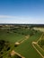 Aerial view of a patchwork of farm fields in the Suffolk countryside