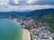 Aerial view of Patong beach, Phuket island and sea in summer, and urban city with blue sky for travel background, Andaman ocean,