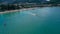 Aerial view of Patong beach with tourist enjoying the beach and watersport activity.