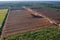 Aerial view of peat harvesting field. Peat extraction