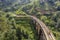 Aerial view of people on the famous Nine Arch Bridge built in 1921 in the jungle on the island of Sri Lanka