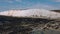 Aerial view of people hiking, walking at the seafront beach during the low tide at Hope Gap. Seaford Head Nature Reserve