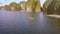 Aerial View People Sail in Kayak Past Floating Farms