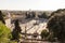 Aerial view of people, sculptures, fountain and churches on Piazza del Popolo in Rome, Italy.