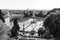 Aerial view of people, sculptures, fountain and churches on Piazza del Popolo in Rome, Italy.