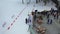 Aerial view of people on a ski lodge preparing for a ski competition. Footage. Sports and competitions