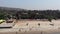 Aerial View of People walking on Sand Beach with Background Tree and Mountains Arambol Goa, India Asia