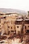 Aerial view of people working at tannery by slum and destroyed buildings