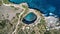 Aerial view of a person along the whole sand beach coastline, Nusa Penida. Bali, Indonesia, July 20, 2023