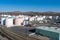 Aerial view of a Petroleum fuel storage tank farm near some railroad tracks.