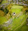 Aerial view of Peveril Castle ruins in Castleton in Peak District, England