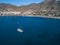 Aerial view photo of Luxury vintage two masted tourist trip ship stays on anchor in the bay, calm transparent water of