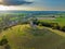 Aerial view of the picturesque Burrow Mump hill and historic site overlooking Southlake Moor