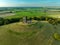 Aerial view of the picturesque Burrow Mump hill and historic site overlooking Southlake Moor