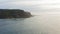 Aerial view of the picturesque high coastline, sharp cliffs and raging sea